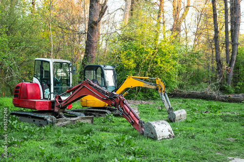 two excavators in the forest