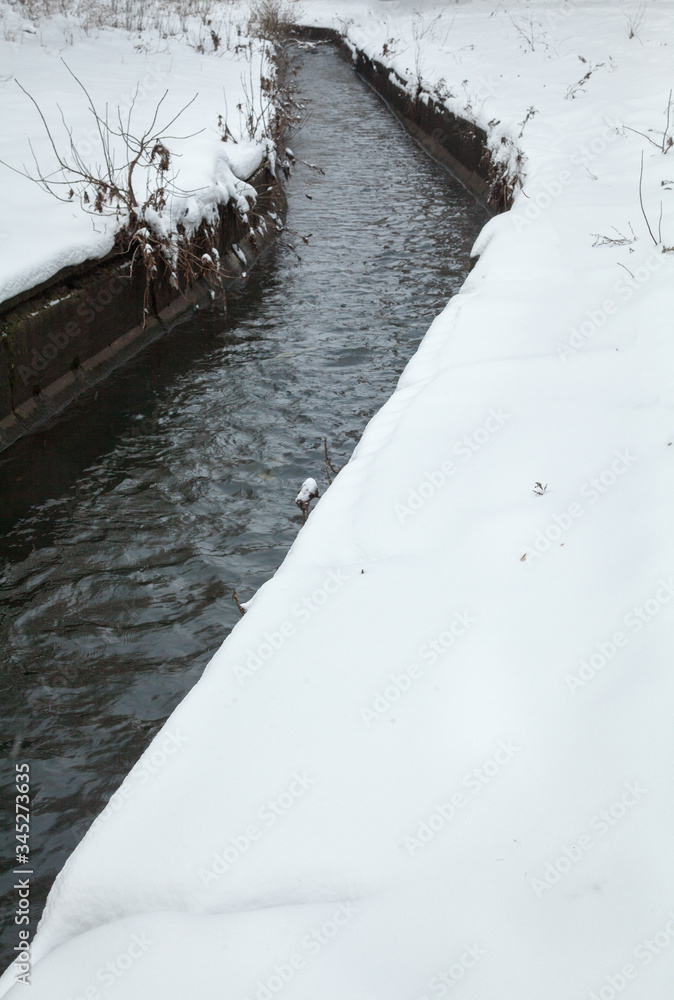 Urban stream in winter. The Lybid river. Urban stream in winter. The Lybid river.