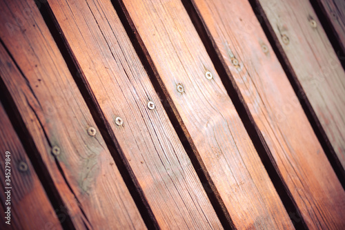 Rustic wooden background texture: Closeup of old wooden planks, golden color