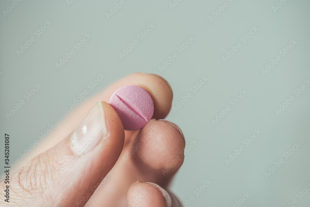 Medicament or cure concept. Close up of male hand with pills. Medicament or cure concept. Close up of male hand with pills.