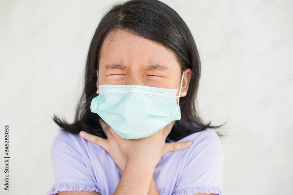 asia women wearing hygienic mask to prevent the virus PM2.5, Coronavirus, (2019-nCoV) asian little girl feeling unwell and coughing as symptom for cold or pneumonia,bronchitis. healthcare concept. asia women wearing hygienic mask to prevent the virus PM2.5, Coronavirus, (2019-nCoV) asian little girl feeling unwell and coughing as symptom for cold or pneumonia,bronchitis. healthcare concept.