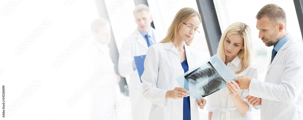 Team of expert doctors with MRI picture Team of expert doctors with MRI picture