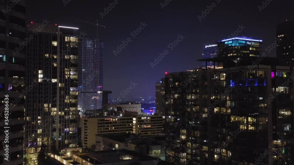 Los Angeles. Downtown. 2019. Aerial shot of a group of skyscrapers in the dark. Modern buildings of city center of large metropolis . Beautiful panorama of a brightly lit night city. 4K Los Angeles. Downtown. 2019. Aerial shot of a group of skyscrapers in the dark. Modern buildings of city center of large metropolis . Beautiful panorama of a brightly lit night city. 4K