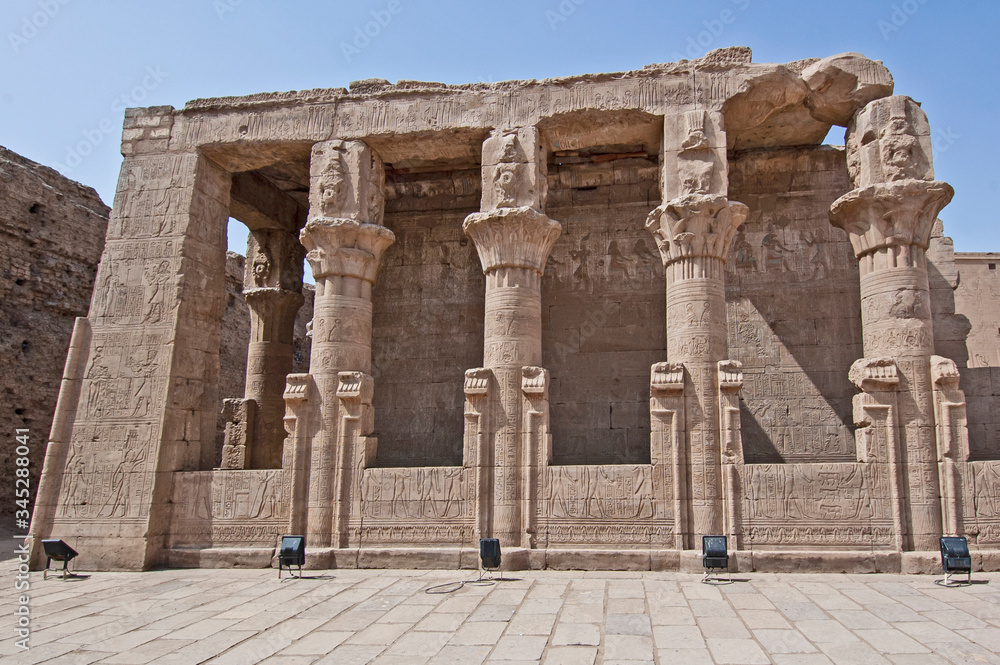 Fototapeta premium Hieroglyphic carvings on ancient egyptian temple columns