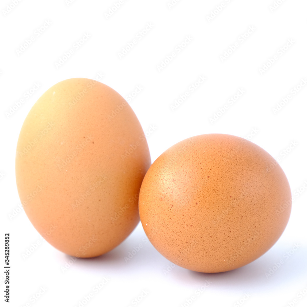 Close-up top view of organic raw eggs on white background with copy space for your text, healthy eating concept. Close-up top view of organic raw eggs on white background with copy space for your text, healthy eating concept.