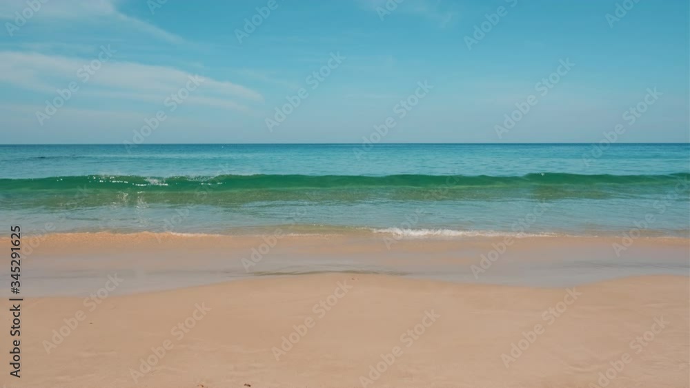 Relaxing slow motion view of turquoise ocean waves roll in on the peaceful shore on tranquil tropical beach. Relaxing slow motion view of turquoise ocean waves roll in on the peaceful shore on tranquil tropical beach.