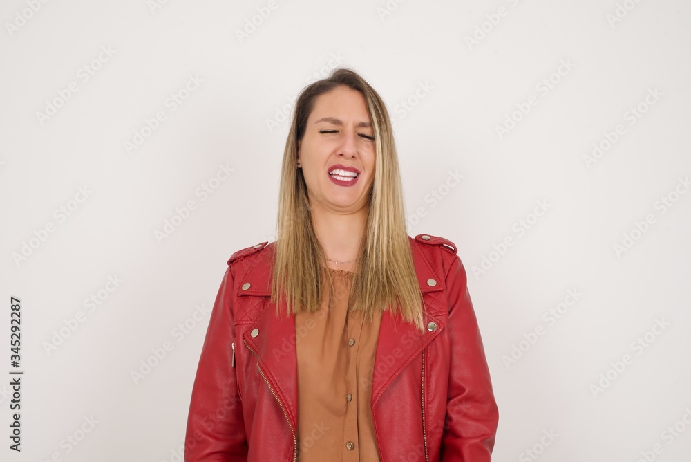 Negative human expressions and attitude. Angry dissatisfied female has disgusting expression as sees something not appealing, frowns face, isolated over white background. Distaste and dislike Negative human expressions and attitude. Angry dissatisfied female has disgusting expression as sees something not appealing, frowns face, isolated over white background. Distaste and dislike