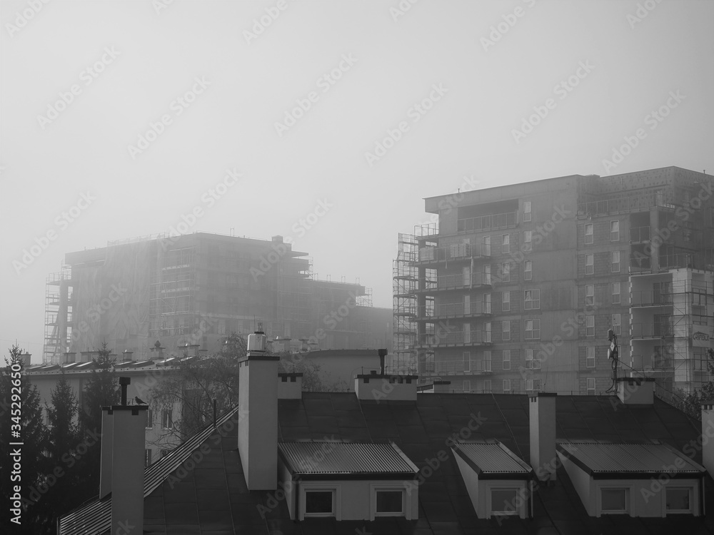 city building in fog wallpaper