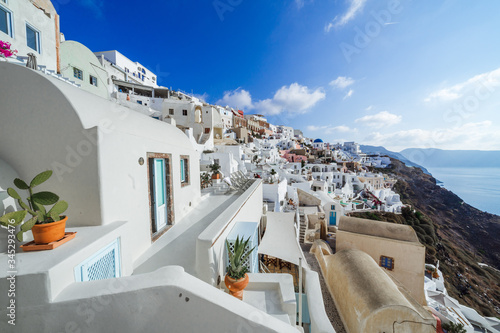 Oia architecture, white houses and terrace, Santorini island, Cylades, Greece photo