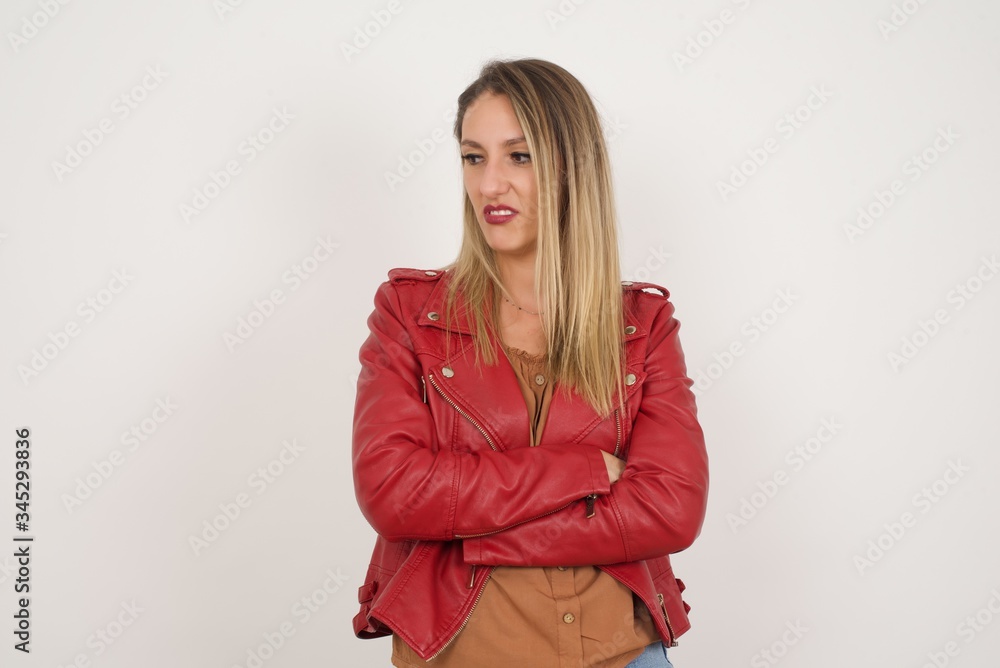 Closeup portrait displeased pissed off angry grumpy pessimistic woman with bad attitude, arms crossed looking sideways. Negative human emotion facial expression feelings Closeup portrait displeased pissed off angry grumpy pessimistic woman with bad attitude, arms crossed looking sideways. Negative human emotion facial expression feelings