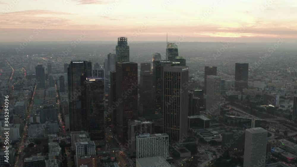 AERIAL: Breathtaking view of skyscrapers in Downtown Los Angeles, California at beautiful Sunset AERIAL: Breathtaking view of skyscrapers in Downtown Los Angeles, California at beautiful Sunset