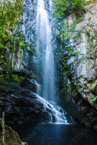 great waterfall in the middle of a spectacular forest and granite rock in Galicia  Spain. Augacaida waterfall  in the Ribeira Sacra of the Mi  o river