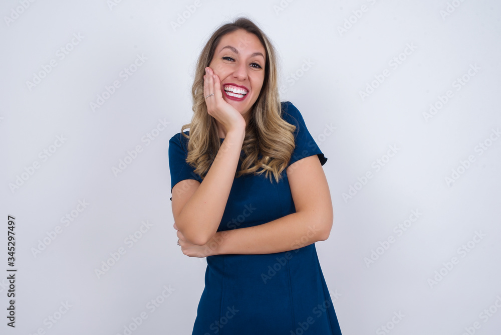 Surprise astonished beautiful girl looking surprised in full disbelief wide open mouth with hand near face. Positive emotion facial expression body language. Surprise astonished beautiful girl looking surprised in full disbelief wide open mouth with hand near face. Positive emotion facial expression body language.