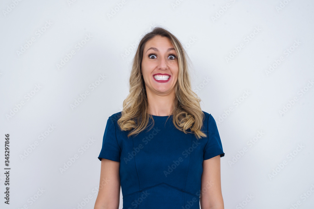 Young beautiful girl with an afro hairstyle having broad white smile being excited to meet Friends and go out to have a good day. Young beautiful girl with an afro hairstyle having broad white smile being excited to meet Friends and go out to have a good day.