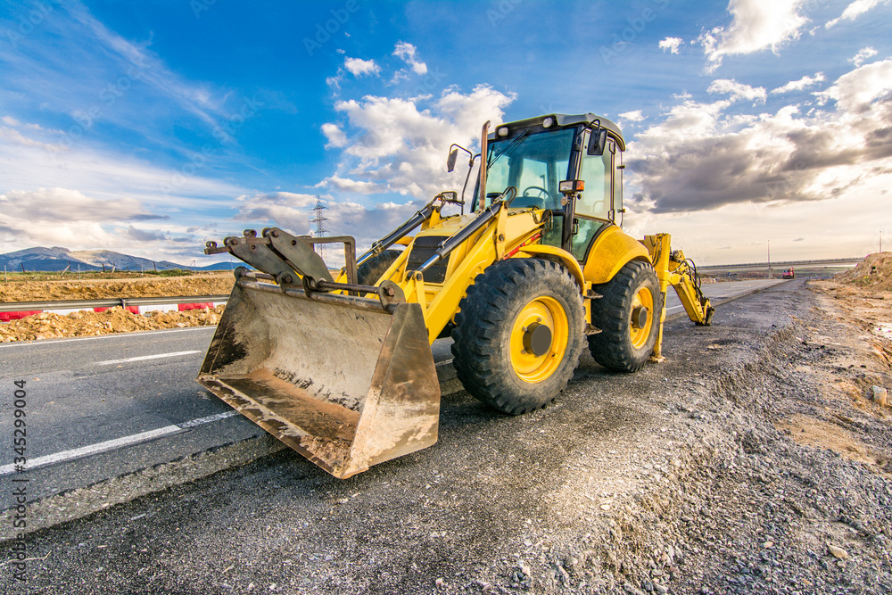Repair of damaged sections of road with heavy machinery Repair of damaged sections of road with heavy machinery