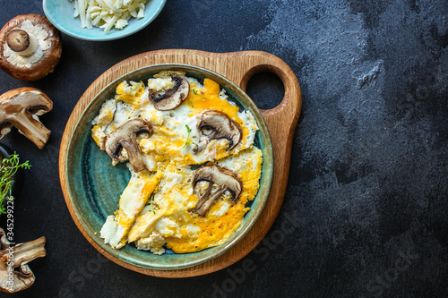 scramble fried eggs omelet with mushrooms Menu concept healthy eating. food background top view copy space for text keto or paleo organic product diet