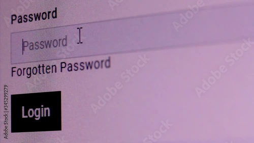 Login web page closeup. Entering password and clicking the button Login on computer screen