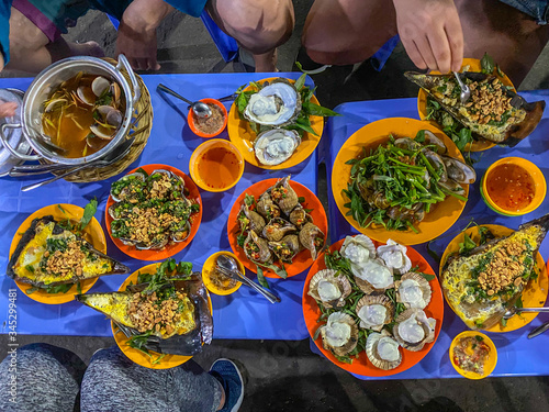Top view photo of snails feast- Vietnamese street food style