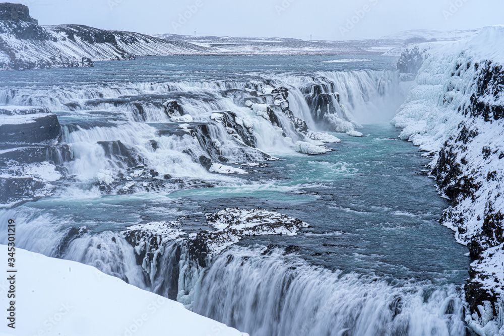 Fototapeta premium Gulfoss in Icelands Interior, snow covered waterfalls.