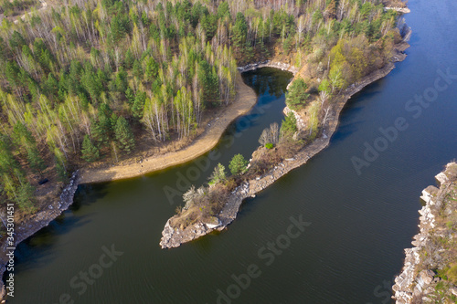 Natural landscape. The Teteriv River and the beautiful island, like a snake's head. Colorful forest with birches and pines. North of Ukraine photo