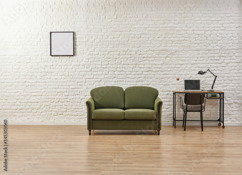 Minimal furniture style, white brick wall background and green armchair.
