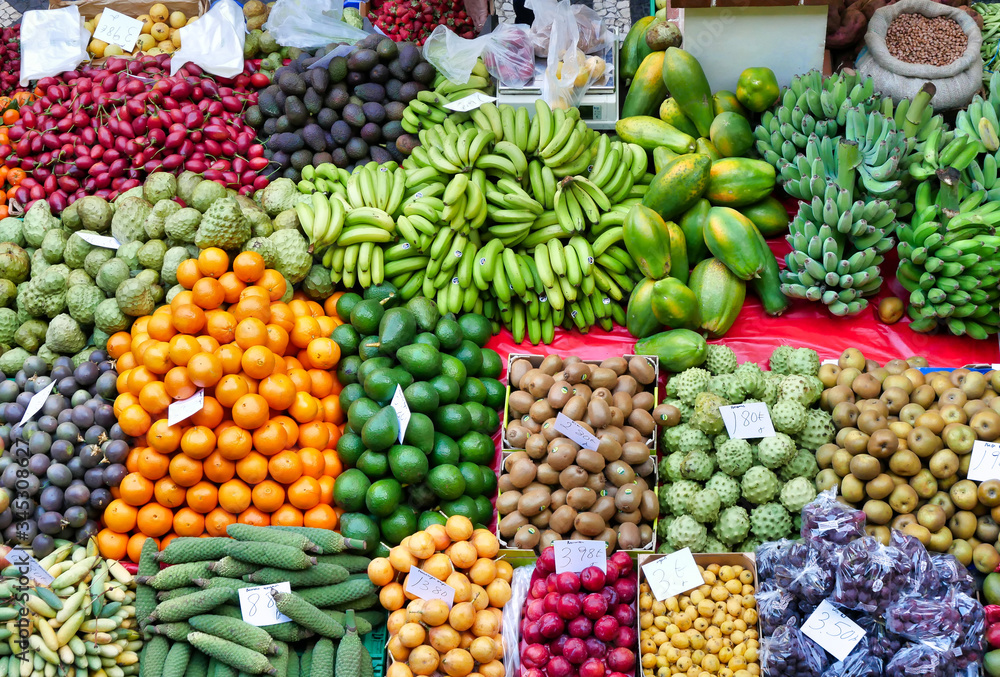 A variety of fruit and vegetables in an open air market market on the island of Madeira