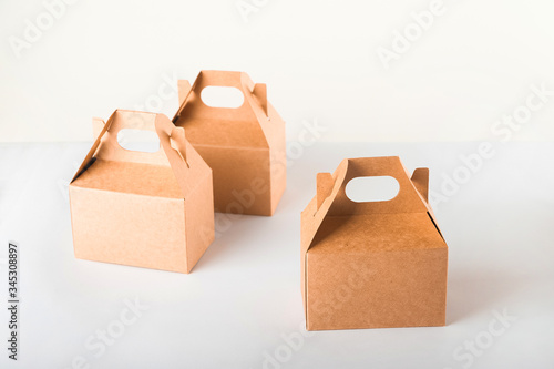 Sales of products.  A lot of boxes on a white background close-up and copy space.The concept commerce, online shopping. Purchasing power, delivery order. E-commerce, sales and sale of goods through on