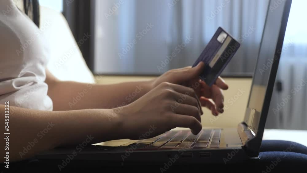 girl makes online sale shopping concept with laptop digital tablet. brunette lying on the couch watching shop online paying credit card. Shop online lifestyle score girl makes online sale shopping concept with laptop digital tablet. brunette lying on the couch watching shop online paying credit card. Shop online lifestyle score