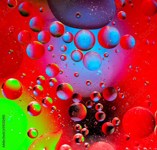 Abstract colorful background from luminous circles of water planets, square