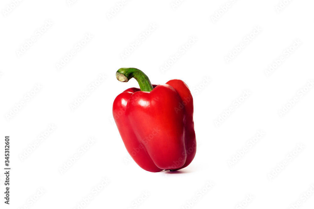 Red bell pepper stands on a white background. Bright color. Two light sources. Red bell pepper stands on a white background. Bright color. Two light sources.