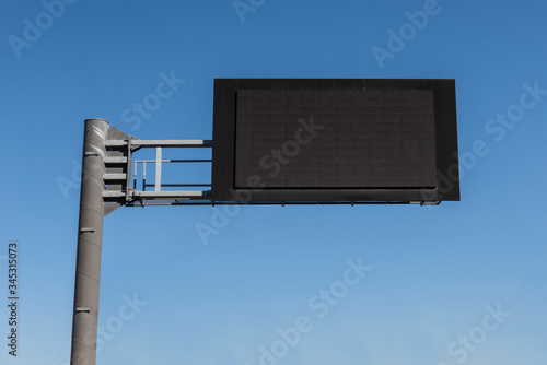 Digital Empty Road Signboard in the blue sky background.