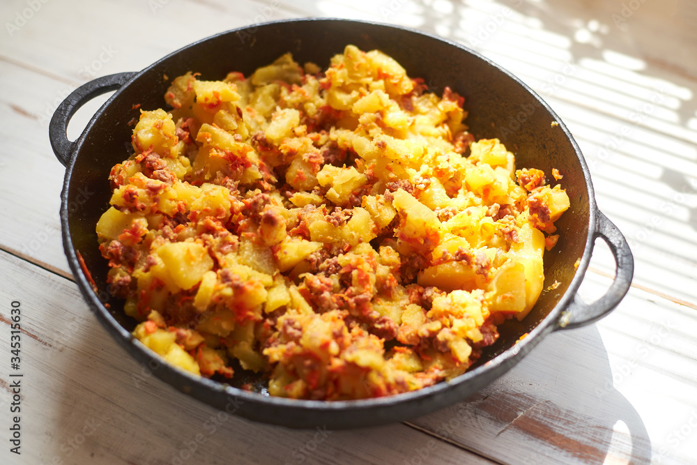 Baked potatoes with minced meat, onions and carrots baked in a pan. Baked potatoes with minced meat, onions and carrots baked in a pan.