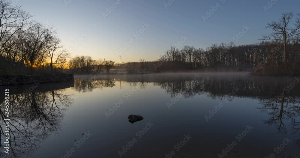 Beautiful reflections and fog in a pond at sunrise in New Jersey Beautiful reflections and fog in a pond at sunrise in New Jersey