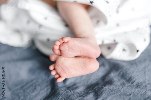 baby's feet on a blue sheet