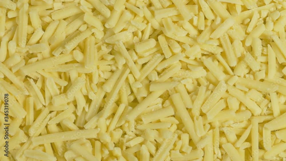 Plate Of Grated Cheese Turning Top Down View Plate Of Grated Cheese Turning Top Down View