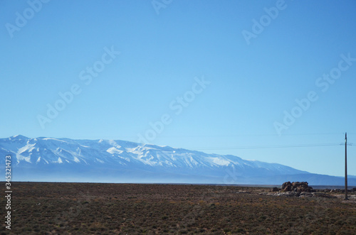 Road along the mountains in Ziz Gorges, Morocco, on a blue day. The journey from Fes to Merzouga desert.