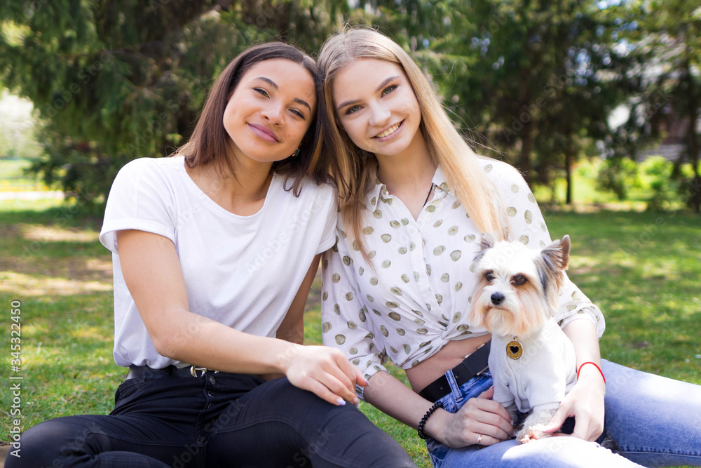 A diversity of girlfriends. International friendship of girls, girls at a picnic A diversity of girlfriends. International friendship of girls, girls at a picnic