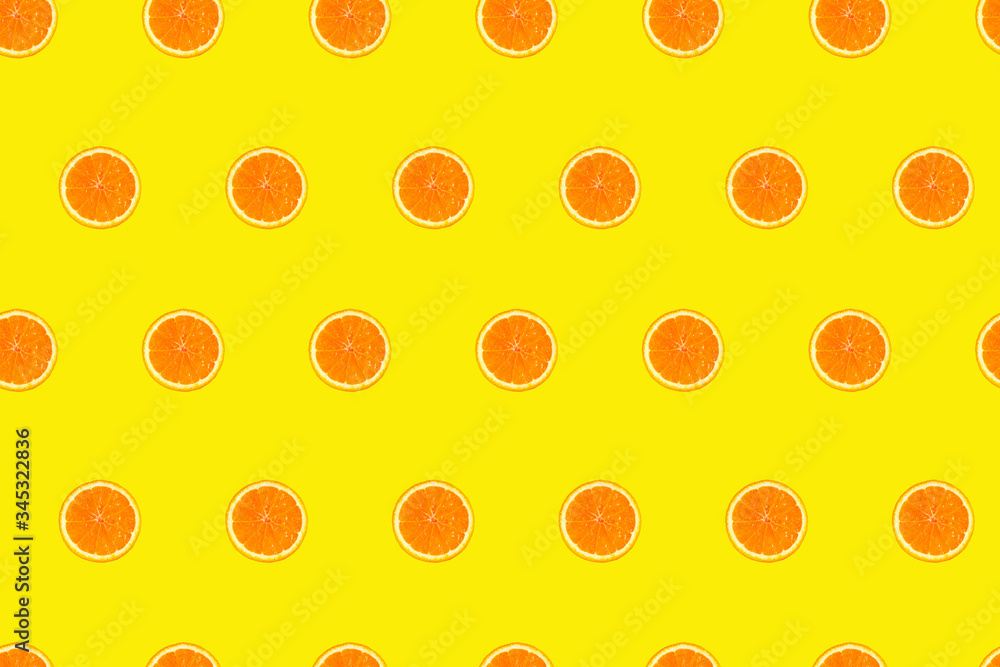 Cutted orange slices on yellow background seamless pattern Cutted orange slices on yellow background seamless pattern