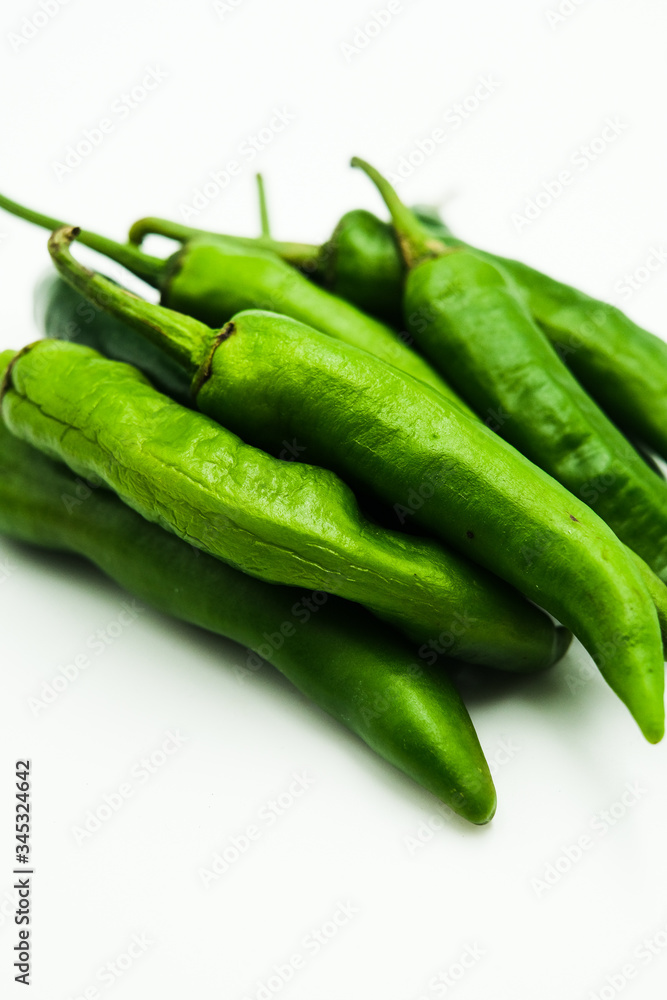 Green Chili or peppers or Capsicums , shots on isolated white background. Green Chili or peppers or Capsicums , shots on isolated white background.