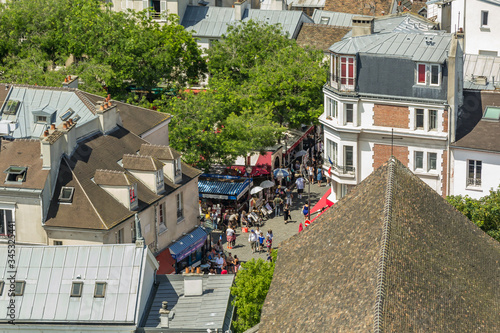 PARIS, FRANCE - JUNE 23, 2016: Aerial view of church of Saint Pierre de Montmartre from Basilica of the Sacred Heart of Jesus stands at the summit of the butte Montmartre - highest point in the Paris