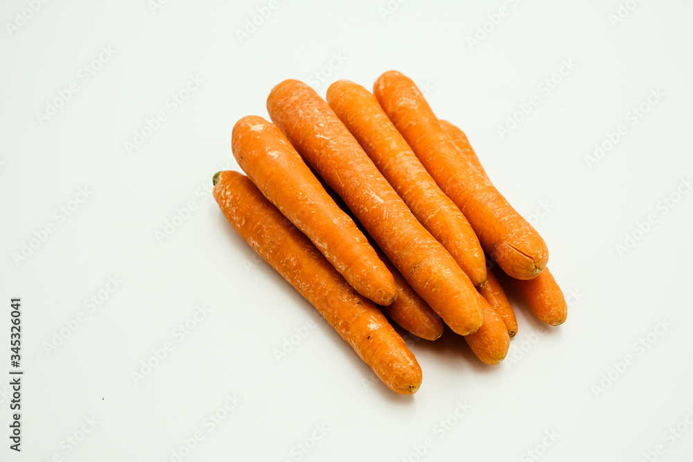 Carrot or Daucus carota subsp. sativus, shots on isolated white background.
