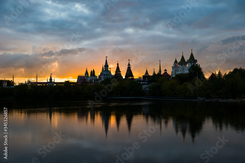 View Of The Kremlin Izmailovo Through A Silver-Grape Pond At Sunset