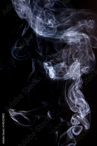 Smoke motion on black background. © peterkai