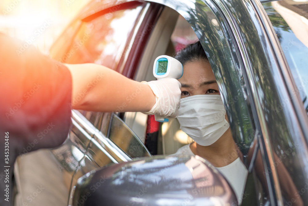 Face Gate Mask New normal concept. Asia woman driver with face mask entering gate ...