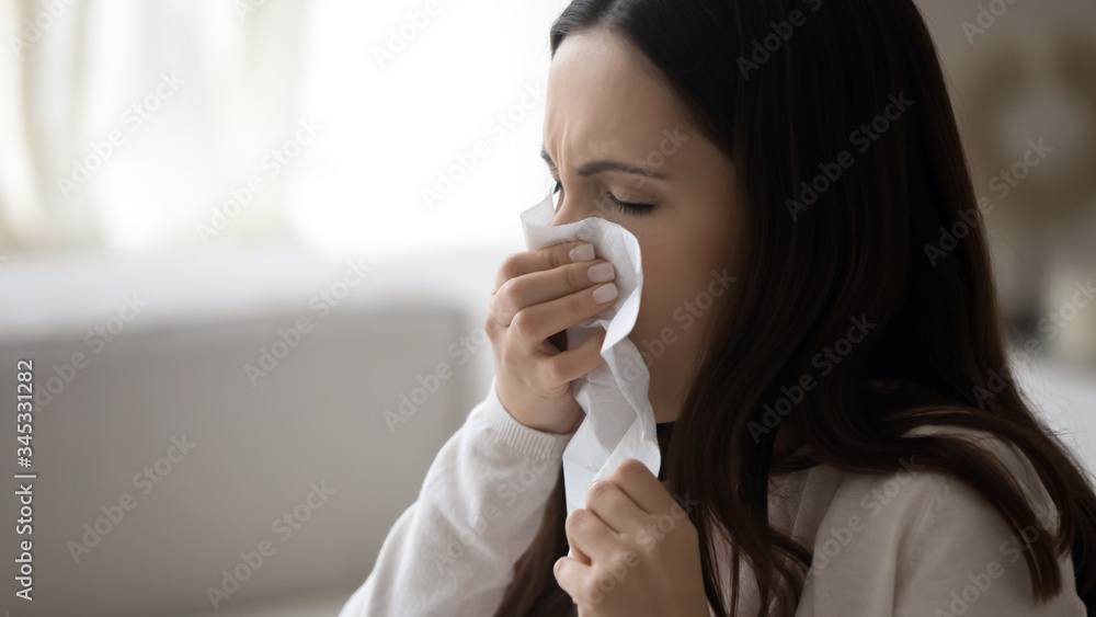 Sick young Caucasian woman sit at home blow nose coughing sneezing feeling unwell unhealthy, ill millennial girl suffer from runny nose, influenza or caught cold, have health problems or illness Sick young Caucasian woman sit at home blow nose coughing sneezing feeling unwell unhealthy, ill millennial girl suffer from runny nose, influenza or caught cold, have health problems or illness