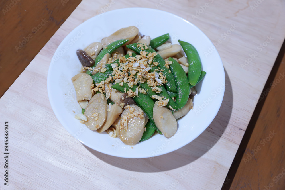 Mushrooms Stir Fried with Oyster Sauce on white plate. Mushrooms Stir Fried with Oyster Sauce on white plate.