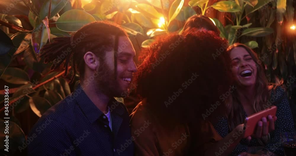 Close up black woman showing video on smartphone to friends Close up black woman showing video on smartphone to friends