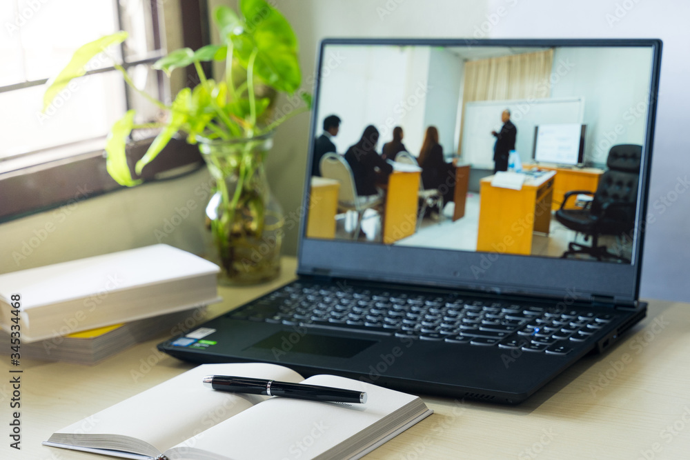 Concept of student watching lesson online on pc and studying from home. Online study and working from home concept during COVID-19 pandemic. Concept of student watching lesson online on pc and studying from home. Online study and working from home concept during COVID-19 pandemic.