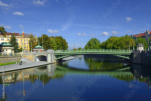 Hradec Kralova - embankment of the river Elbe. Hradec Kralove is a big city in the Hradec Kralove Region of Bohemia, Czech Republic photo