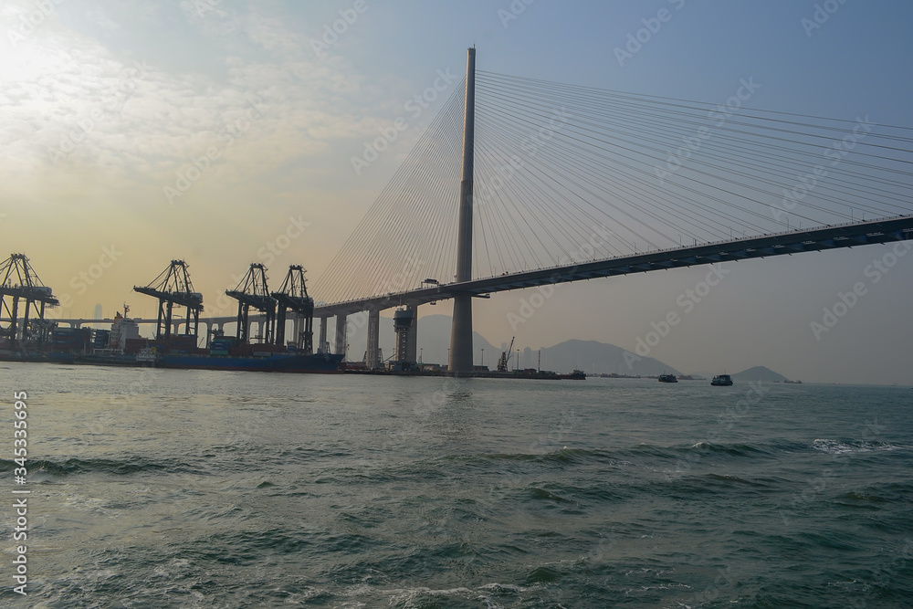 Obraz premium industrial port near Hong Kong city with cranes in operating